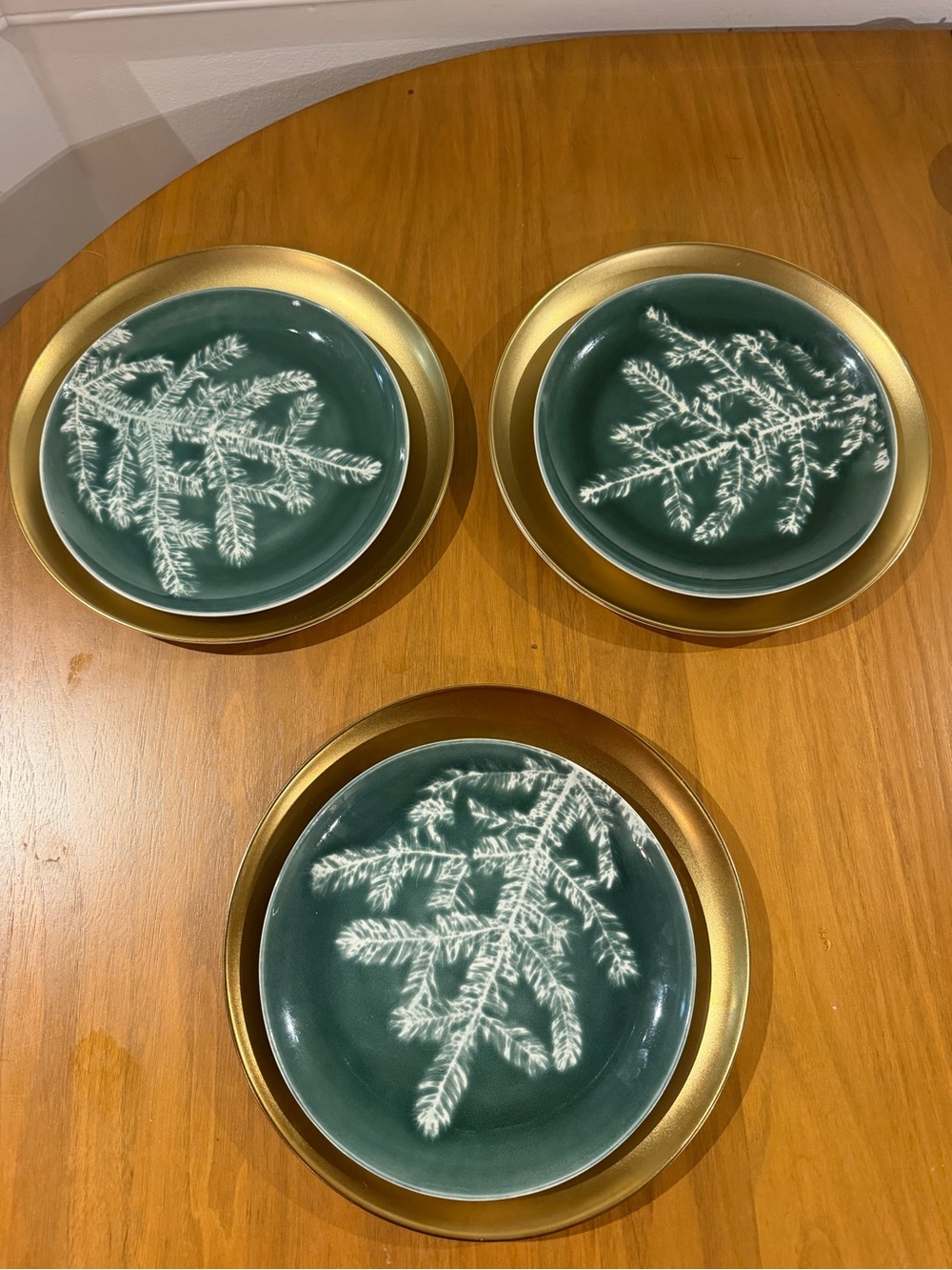 Set of three gold West Elm Plates